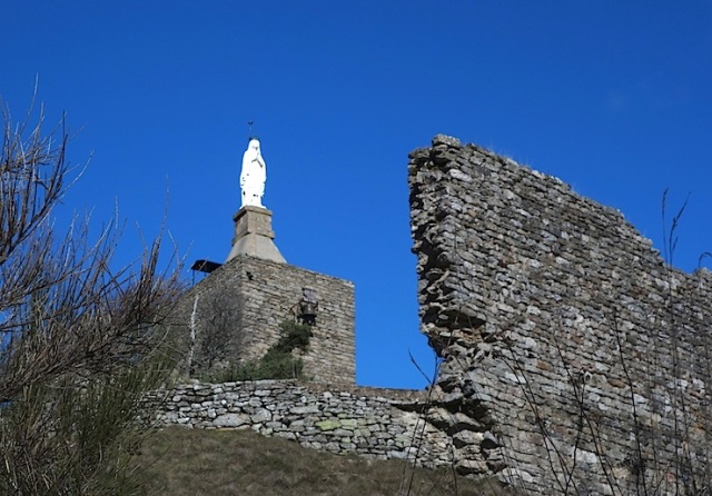 White Madonna keeping watch over the ruins of the Chateau de Luc. 