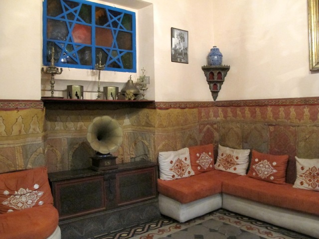 Lounge area adjacent to reception. A feature of the area is the blue five-pointed star (interlaced pentangle) part of the wall above the gramophone. 